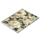 クリームの背景に白い花。 ノートブック (左側)