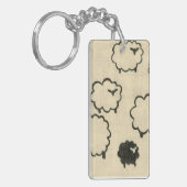 クリームの背景に白と黒の羊 キーホルダー (正面左)
