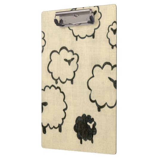 クリームの背景に白と黒の羊 クリップボード (左)