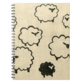 クリームの背景に白と黒の羊 ノートブック (正面)
