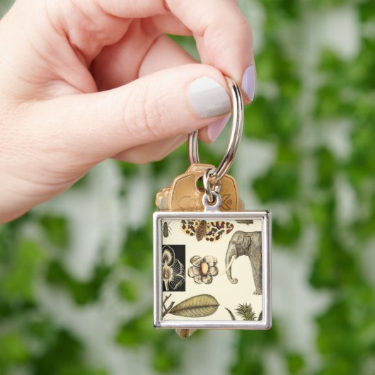 クリームの背絵を描景にさまざまな動物 キーホルダー (手)