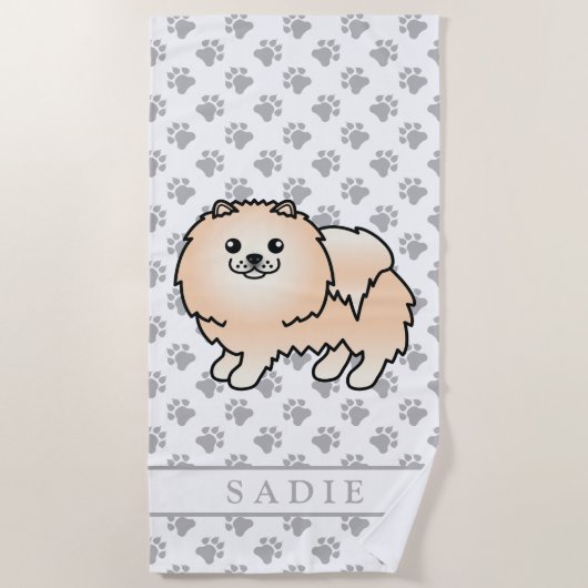 クリーム色のポメラニアンのかわいいキャラクター犬と名前 ビーチタオル (正面)