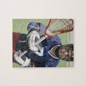 クロスを持つ深刻なラクロス選手 ジグソーパズル (横)