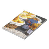 クロワッサンとチョコレートパン入りのバスケット。 ノートパッド (回転)