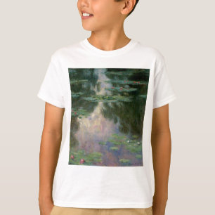 クロード・モネによるピンクの緑の池の睡蓮 Tシャツ