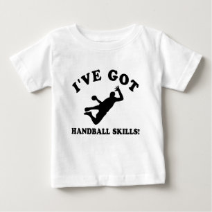 クールなハンドボールの技術のデザイン ベビーTシャツ