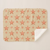 グラデーションのテラコッタオレンジ色の星模様 シェルパブランケット (正面(横))