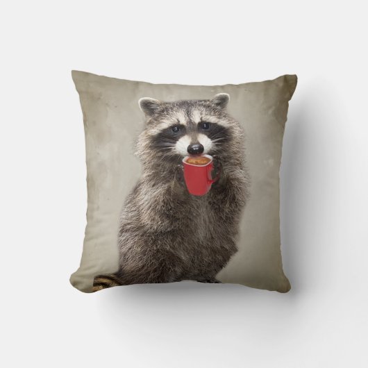 グラフィックアートおもしろいラクーンがコーヒーユーモアを飲む クッション (正面)