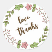 グリーンの葉とピンクの花のブライダルシャワー ラウンドシール (正面)