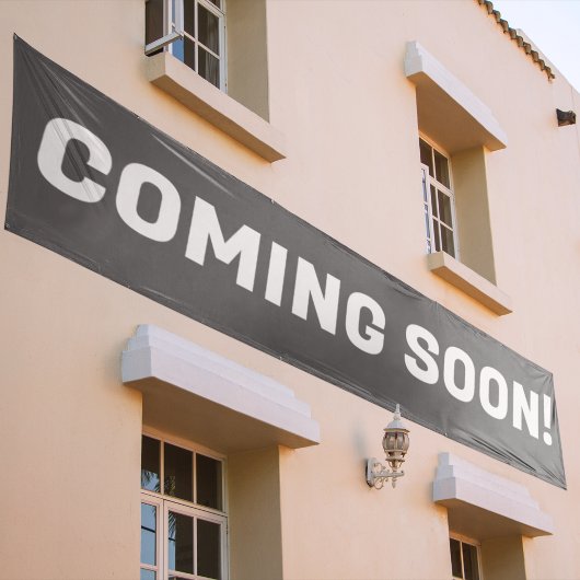 グレーとホワイト広告の文字来ズ・マーン 横断幕