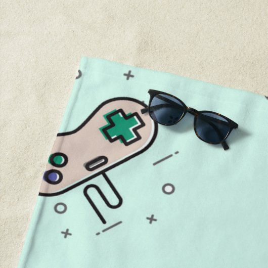 グレーのゲームジョイスティックを青で表示 ビーチタオル (インサイチュ)