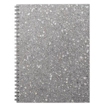 グレーの斑点があるスパイラルノートブック