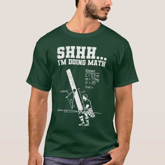 ケイバー・トスが面白いハイランド・ゲームの少年 Tシャツ (正面)