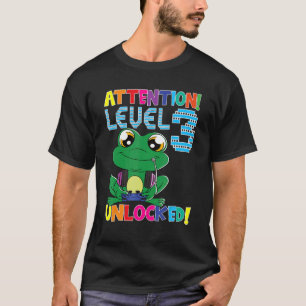ゲーマーカエル少年の注意レベル3ロック解除されたゲームB Tシャツ