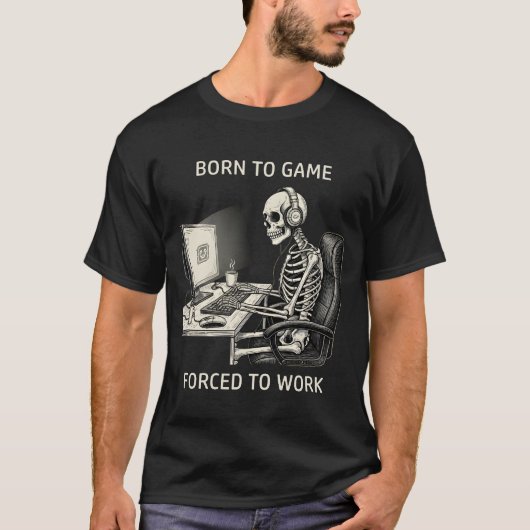 「ゲームに生まれて仕事を余儀なくされた」ドクロの面白グッズ Tシャツ (正面)