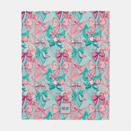 コケットピンク、ティール(緑がかった色)、マゼンタボウをテーマにしたモノグラム フリースブランケット (正面)