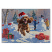 コッカー走スパニエル犬の雪のクリスマスハット カッティングボード (正面)