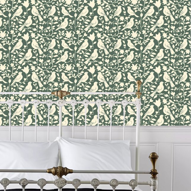 コテージコアペーパーカットバードオングリーン 壁紙 (Cottagecore Papercut Birds on Green Wallpaper behind a white metal framed bed.)