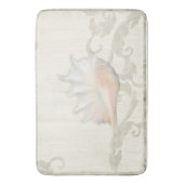 コンチシェルとサンゴの赤面の巻物が木に広がる バスマット (正面縦)