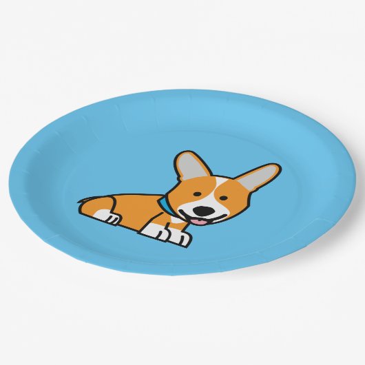 コーギーのコーギーは子犬の小犬の幸せなペンブロークウェールズの後をつけます ペーパープレート (アングル)