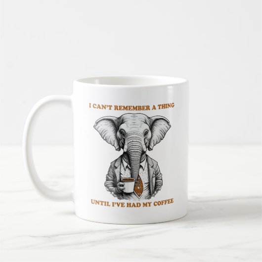 コーヒーを持つゾウ コーヒーマグカップ (左)