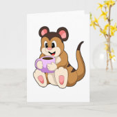 コーヒーカップを持ったミーアキャット カード (黄色い花)