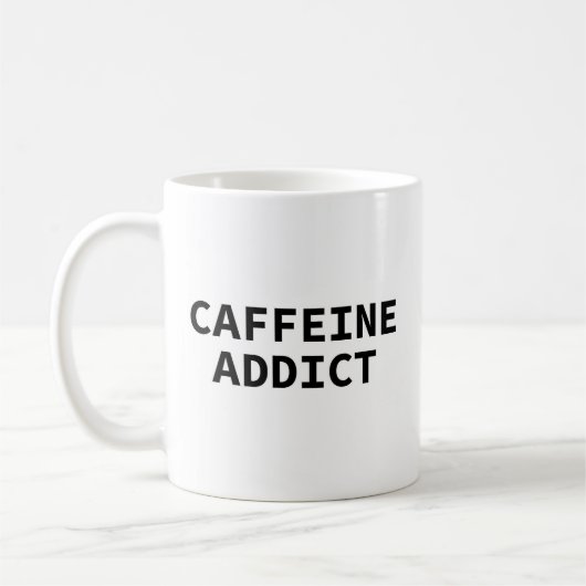 「コーヒー中毒者」マグ コーヒーマグカップ (左)