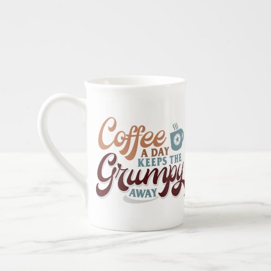 コーヒー愛好家へのギフトにぴったりな「一日一杯のコーヒー」 ボーンチャイナマグカップ (左)