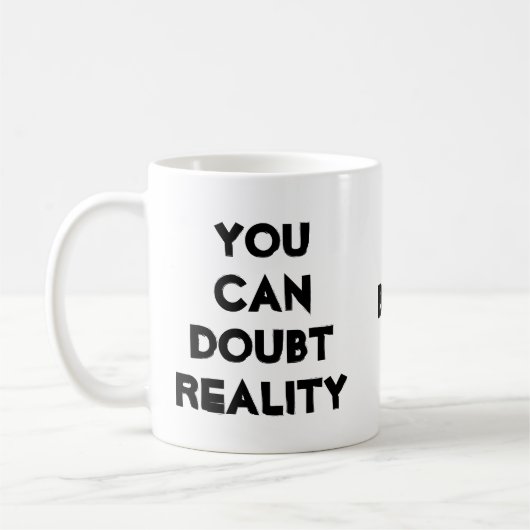 コーヒー、現実と疑いのジョーク コーヒーマグカップ (左)