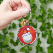 ゴルフボールがサンタ帽子をかぶって赤い背景に登場 キーホルダー (手)