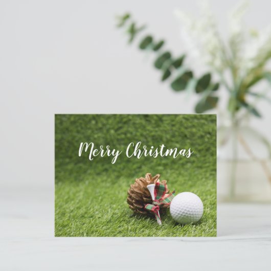 ゴルフボールカードを持つゴルファーへのメリークリスマス ポストカード (スタンド正面)
