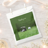 ゴルフボール及びゴルフカートはグリーンゴルファーに乗っている フェイバーバッグ (クリップ留めされた状態)