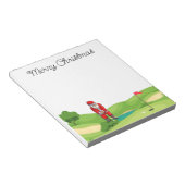 ゴルフ場でゴルファーのサンタクロースのメリークリスマス ノートパッド (アングル)