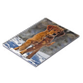 ゴールデンレトリバーの子犬が雪の中に ノートブック (左側)