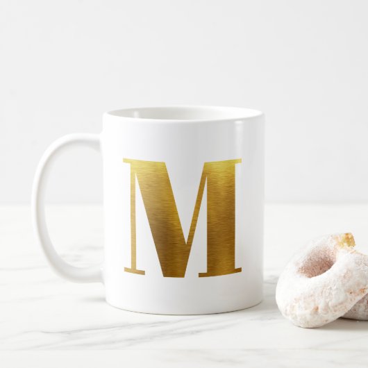 ゴールドの箔押しモノグラム M コーヒーマグカップ (ドーナツ)