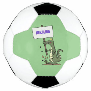 サインおもしろい漫画を持つワニのアリゲータ サッカーボール