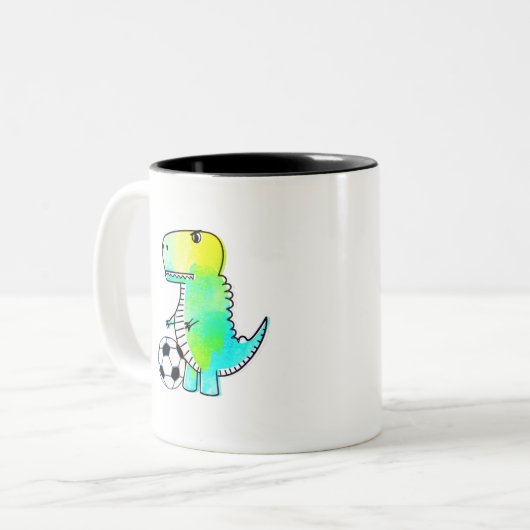 サッカーの水彩が大好きかわいい恐竜 ツートーンマグカップ (正面左)