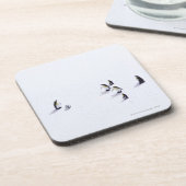 サッカーを遊んでいるペンギン コースター (左側)