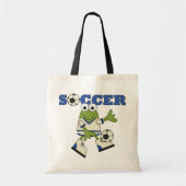 サッカーボールのTシャツおよびギフトを持つカエル トートバッグ (正面)