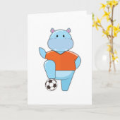 サッカーボールを持つサッカー選手のヒポポタマス カード (黄色い花)