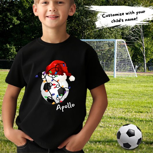 サッカーボールクリスマスライトサンタハット子供名 Tシャツ