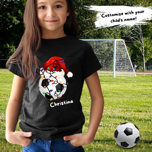 サッカーボールクリスマスライトサンタハット子供名 Tシャツ