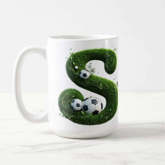 サッカーボール付き芝生の文字 コーヒーマグカップ (左)