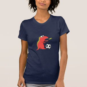 サッカーレディースを遊んでいるおもしろいな漫画の恐竜 Tシャツ