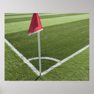 サッカー場の赤いコーナーフラグ ポスター