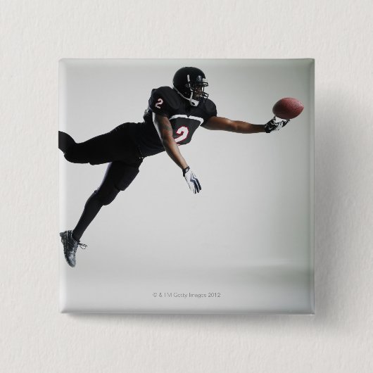 サッカー選手はボールをキャッチするために空中で飛んだ 缶バッジ (正面)