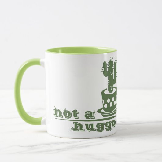 サボテンNot a huggerサボテンおもしろいことわざ マグカップ (左)