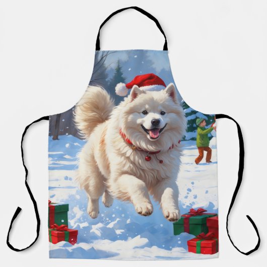 サモエドのクリスマス帽子姿の雪中疾走 エプロン (正面)