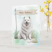 サモエド犬は誕生日標識の下でアウトドアを育てる カード (黄色い花)