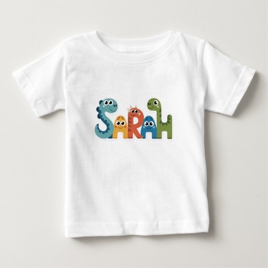 サラ恐竜の名前かわいいディノレターズデザイン ベビーTシャツ (正面)